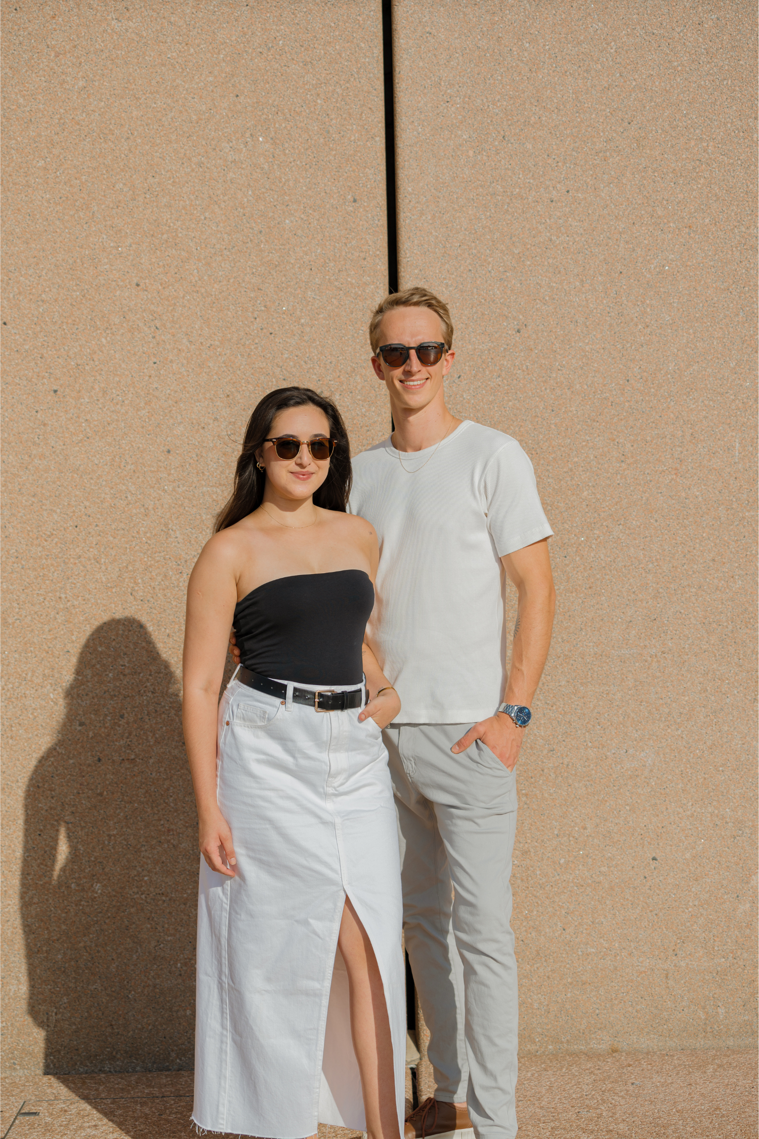 Founders of THE ART LABEL standing side-by-side in front of a beige wall
